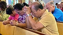Parishioners attend Mass at Sacred Hearts Mission Church in Kapalua, Hawaii, Sunday, Aug. 13, 2023.