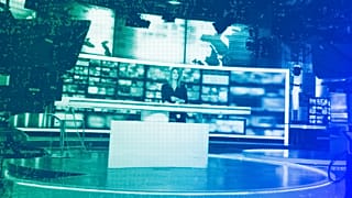 Dagmara Kaczmarek-Szałkow, a news presenter for TVN24, speaks during a live news broadcast in Warsaw, December 2021