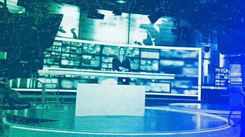 Dagmara Kaczmarek-Szałkow, a news presenter for TVN24, speaks during a live news broadcast in Warsaw, December 2021