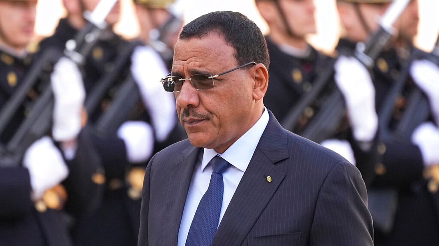Niger's President Mohamed Bazoum walks past Republican Guards before a working lunch with French President Emmanuel Macron Thursday, Feb. 16, 2023 at the Elysee Palace 