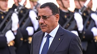 Niger's President Mohamed Bazoum walks past Republican Guards before a working lunch with French President Emmanuel Macron Thursday, Feb. 16, 2023 at the Elysee Palace 