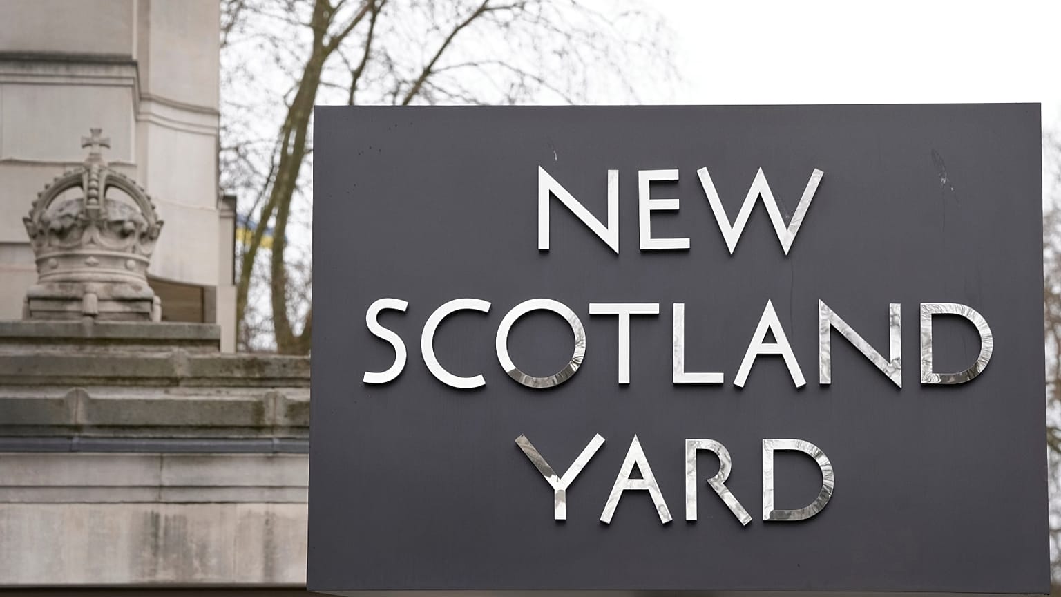FILE: A sign outside New Scotland Yard, the headquarters of the London Metropolitan Police, in London, Tuesday, March 21, 2023.