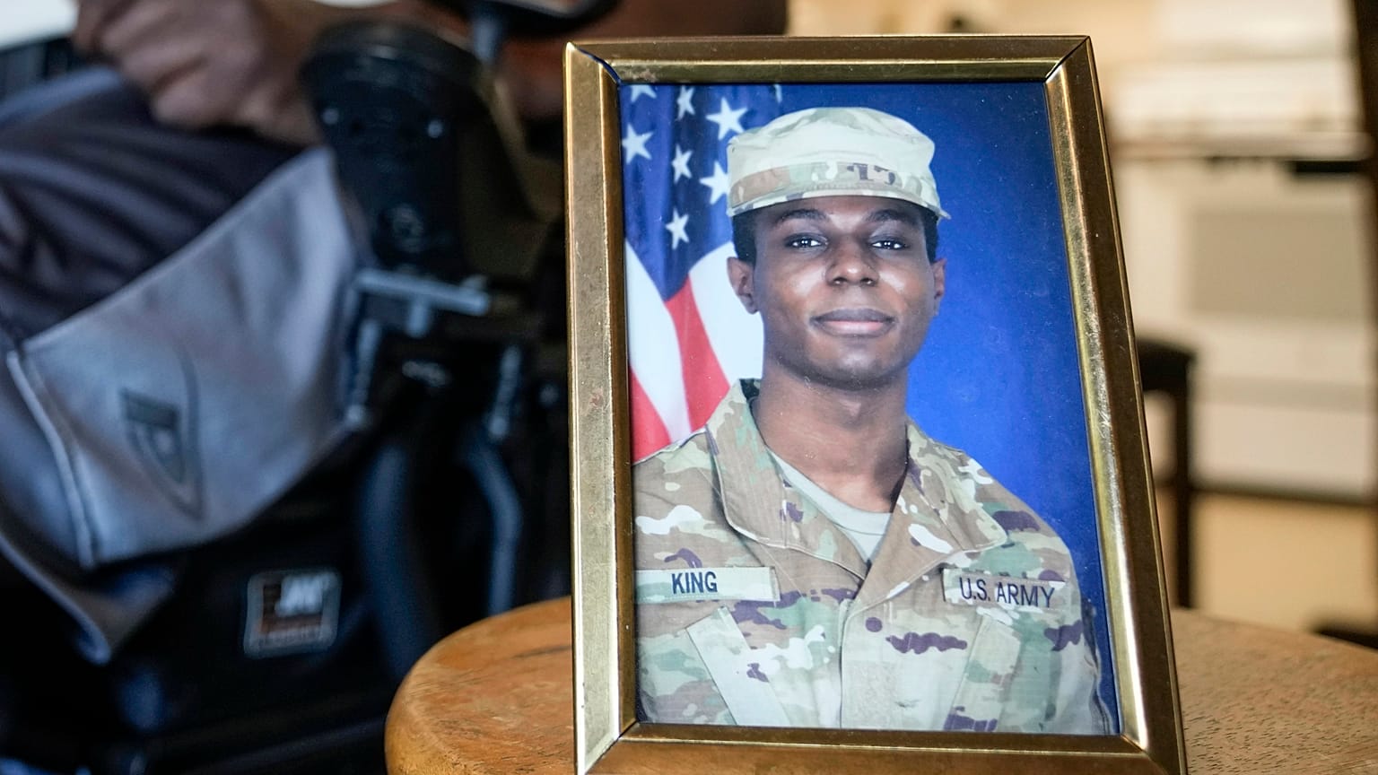 A portrait of American soldier Travis King is displayed as his grandfather, Carl Gates, talks about his grandson on July 19, 2023, in Kenosha, Wisconsin.