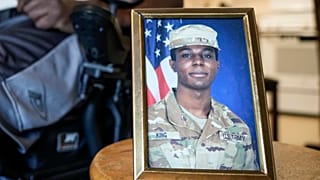 A portrait of American soldier Travis King is displayed as his grandfather, Carl Gates, talks about his grandson on July 19, 2023, in Kenosha, Wisconsin.