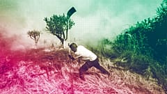 A local resident fights a forest fire with a shovel during a wildfire in Tabara, north-west Spain, July 2022
