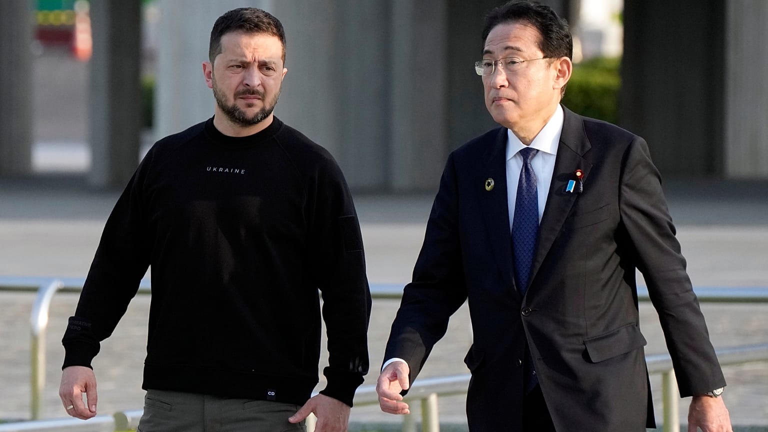 FILE: Ukrainian President Volodymyr Zelenskyy, left, is escorted by Japanese Prime Minister Fumio Kishida in Hiroshima, May 2023