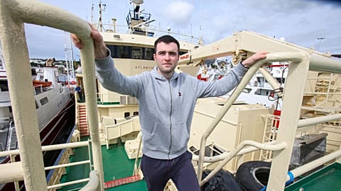 Daragh McGuinness, a deck hand on the Atlantic Challenger, on the fishing vessel moored in the harbour in Killybegs, western Ireland.