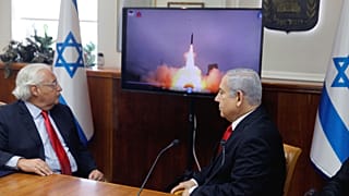 Israeli Prime Minister Benjamin Netanyahu and US Ambassador to Israel David Friedman watch a video which shows the launch of the Arrow 3 anti-ballistic missiles in 2019. 