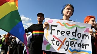 Participants march with a rainbow flag during the LGBT Pride parade in Kharkiv, Ukraine. 15 September 2019