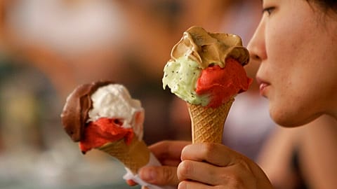 FILE: Customers enjoy cones outside the Giolitti gelateria in Rome in 2010.