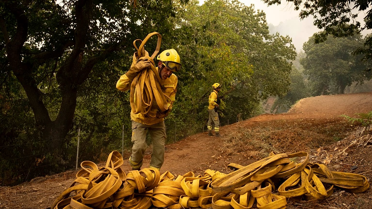Emergency crews and firefighters are working to extinguish the fire advancing through the forest in La Orotava in Tenerife, Canary Islands, Spain on Saturday, Aug. 19, 2023. 