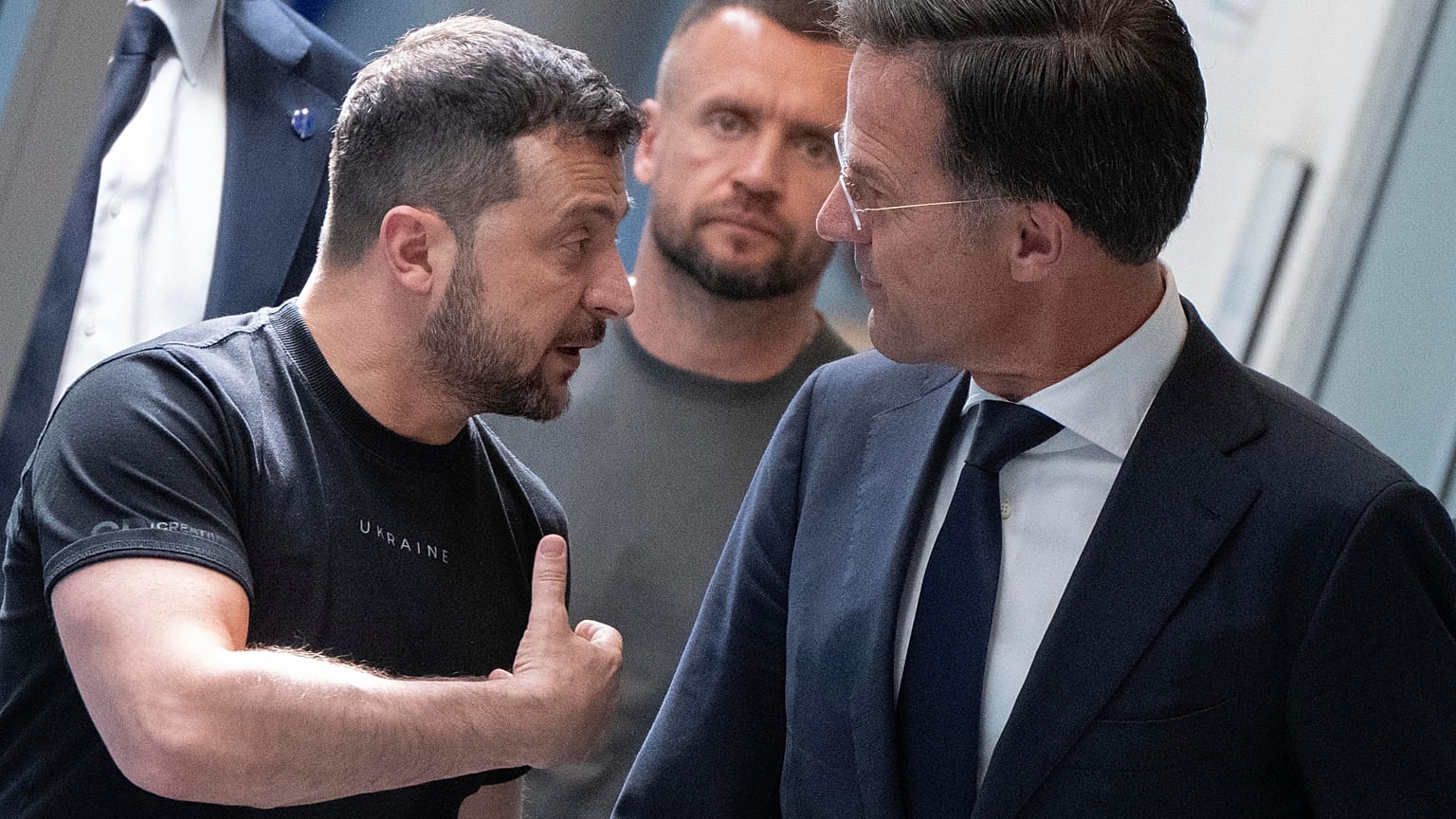 Ukrainian President Volodymyr Zelenskyy, left, and Dutch caretaker Prime Minister Mark Rutte.