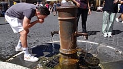 Tourist refreshes at a fountain in Rome, Italy, on 19 August, 2023.