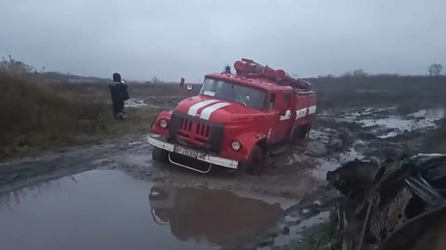 Rescue crews towing civilian vehicles away from the fighting in Ukraine. August 2023