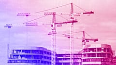 Cranes are viewed on a construction site of a new business building in Bezon, west of Paris, September 2020