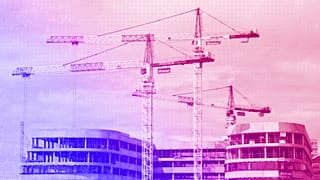 Cranes are viewed on a construction site of a new business building in Bezon, west of Paris, September 2020