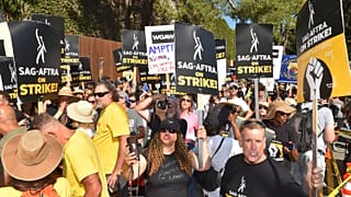 Protesters attend the Day of Solidarity union rally on Tuesday, Aug. 22, 2023, at Disney Studios in Burbank, Calif. 