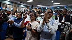 Minister of State for Science and Technology Jitendra Singh (L, front) along with others celebrate the successful lunar landing of Chandrayaan-3 spacecraft.