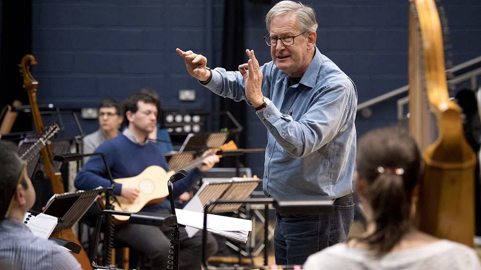 British composer Sir John Eliot Gardiner conducts the orchestra during a rehearsal session at Sadler's Wells Theatre in London.