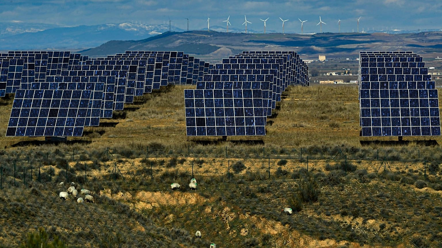 Solar panels work in the town of Milagro, Navarra Province, northern Spain, February 2023. 