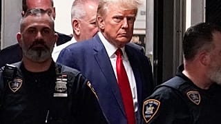 FILE - Former President Donald Trump is escorted to a courtroom, April 4, 2023, in New York.