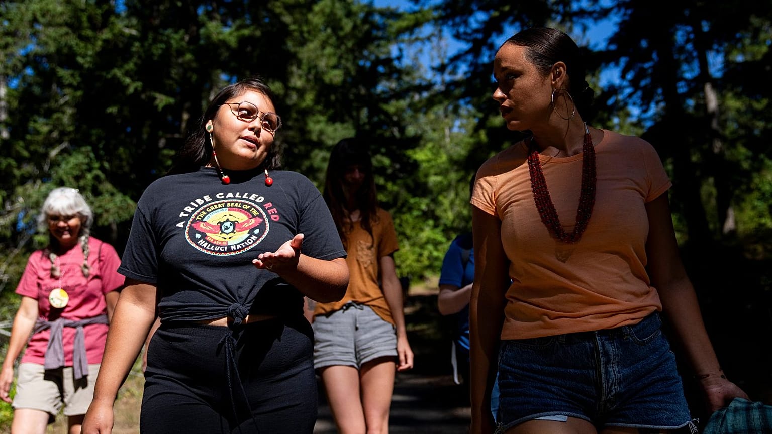 Serina Fast Horse, of Sicangu Lakota & Blackfeet Tribes (L) talks with Jacy Bowles, of Xicana and Diné descent, during the 2023 Tribal Climate Camp in Washington state.