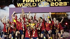 Team Spain celebrates with the trophy after winning the Women's World Cup soccer final against England at Stadium Australia in Sydney, Australia, Aug. 20, 2023.