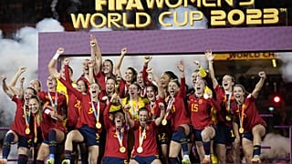 Team Spain celebrates with the trophy after winning the Women's World Cup soccer final against England at Stadium Australia in Sydney, Australia, Aug. 20, 2023.