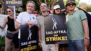Rhea Seehorn, from left, Bryan Cranston, Aaron Paul, Betsy Brandt and Jesse Plemons, from the cast of "Breaking Bad," strike on a picket line outside Sony Pictures studios