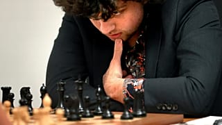 Chess Grandmaster Hans Niemann, 19, studies the board during a match against Grandmaster Christopher Yoo, 15, at the U.S. Chess Championship in St. Louis on 5 Oct 2022