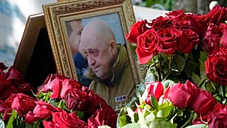 A portrait of Wagner Group's chief Yevgeny Prigozhin, who died last week in a plane crash two months after launching his brief rebellion, lies on flowers on the grave at the P