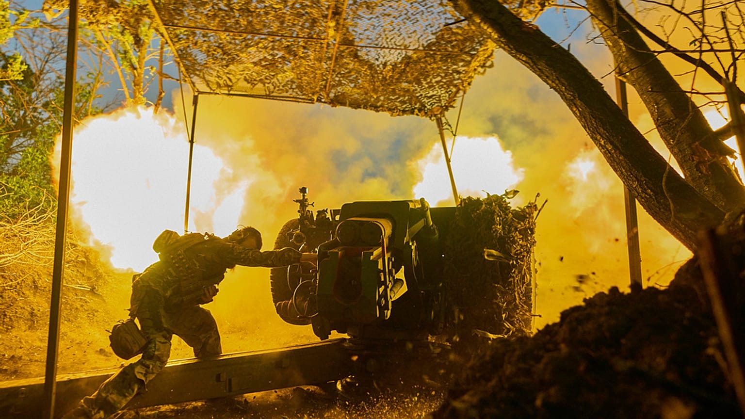 FILE - A Ukrainian serviceman of the 10th Assault Brigade Edelweiss fires a D-30 cannon towards Russian positions at the front line, near Bakhmut, Donetsk region, Ukraine.