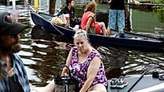 Residents of Twin City Mobile Home Park, navigate through the neighborhood in high waters, Wednesday, Aug. 30, 2023, in St. Petersburg, Florida