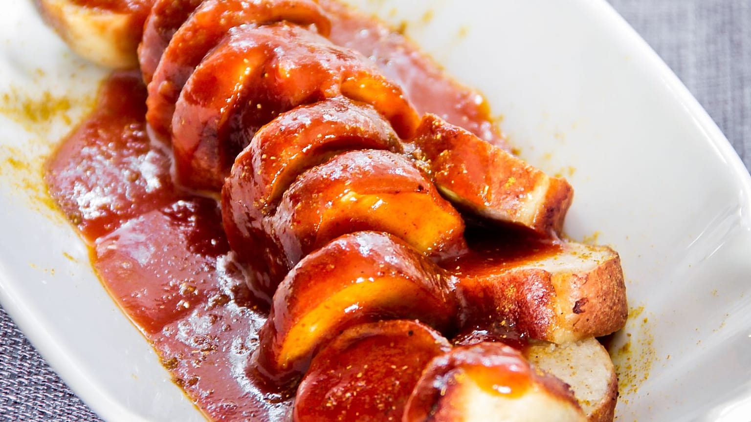 Currywurst, a famous fast food in Germany that features sliced sausage slathered in curry ketchup. 