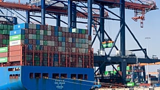 Containers are being moved in the harbor of Rotterdam, Netherlands, Wednesday, March 23, 2022. 
