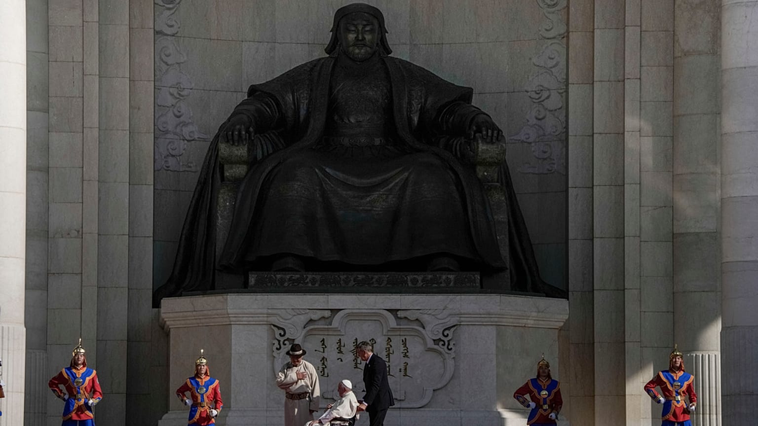 Mongolian President Ukhnaagin Khurelsukh, left, and Pope Francis meet, Saturday, Sept. 2, 2023, in front of a gigantic statue of Genghis Khan