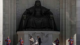 Mongolian President Ukhnaagin Khurelsukh, left, and Pope Francis meet, Saturday, Sept. 2, 2023, in front of a gigantic statue of Genghis Khan