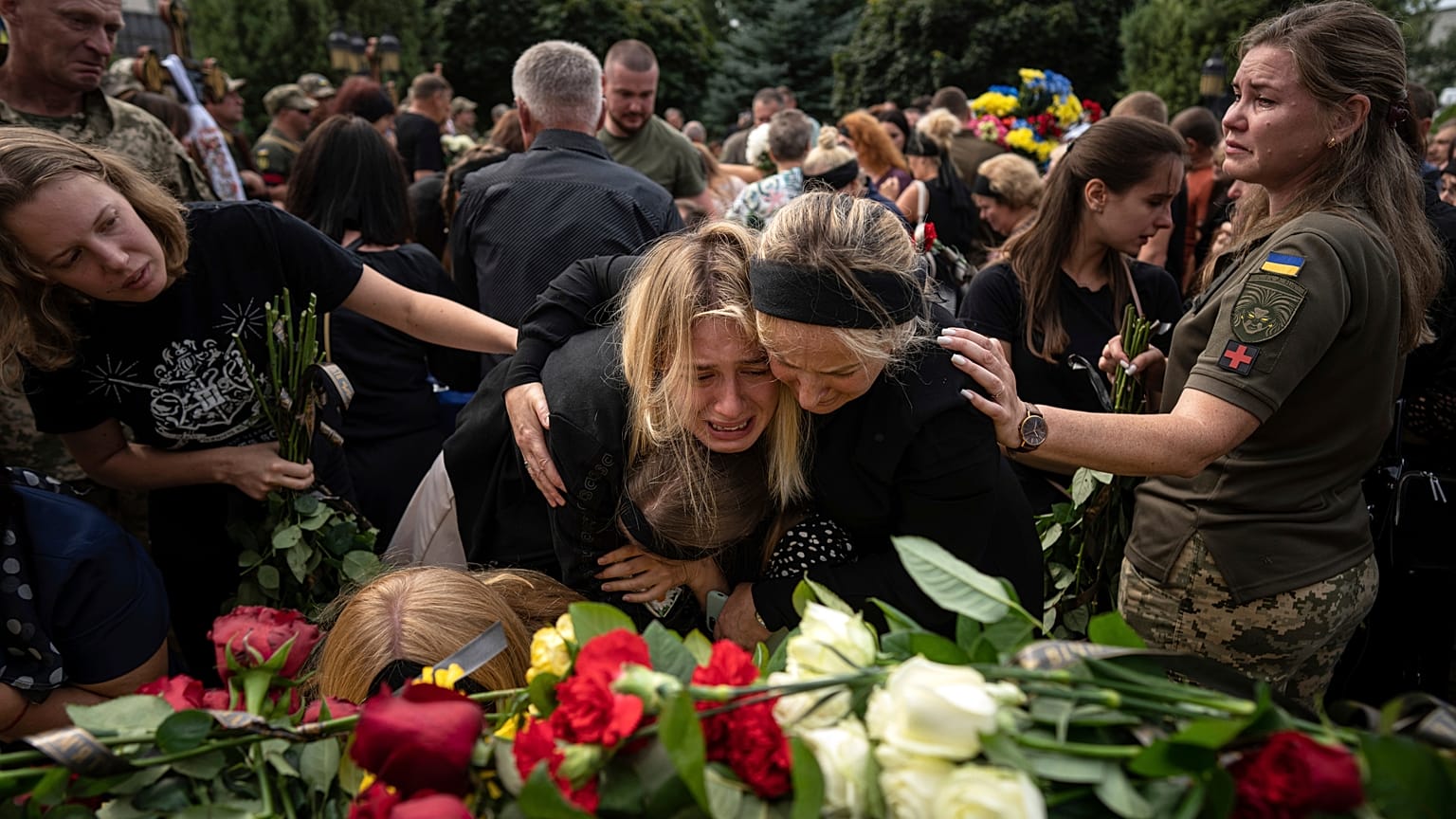 Relatives bid their last farewell to the fallen Ukrainian pilots and crew members of mi-8 military helicopters of the 18 aviation brigade in Poltava
