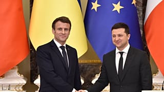 Ukrainian President Volodymyr Zelenskyy and his French counterpart Emmanuel Macron shake hands in Kyiv, 2022