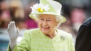 Queen Elizabeth II waves during a walk about around Windsor on her 90th Birthday in 2016