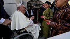 Children in traditional dress welcome Pope Francis arriving for a meeting with charity workers and for the inauguration of the House of Mercy in Ulaanbaatar, Monday, Sept. 4.
