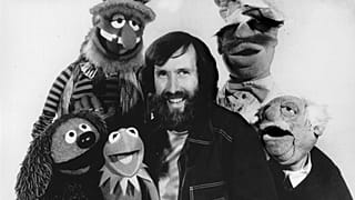 Jim Henson, creator of the Muppet Show, poses in September 1977 with some of the characters he personally operated