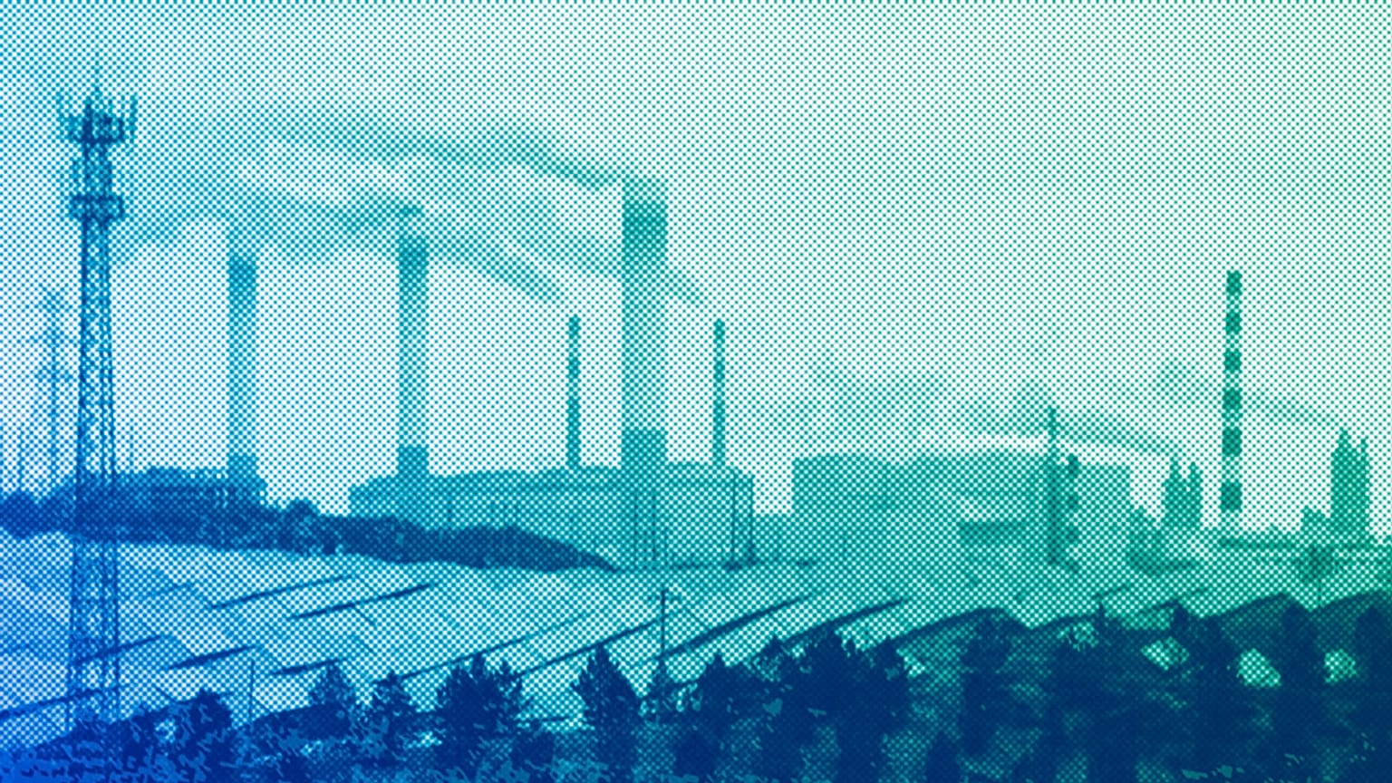 Smoking chimneys and solar panel farm are seen along a highway in a coal producing region in Yulin, April 2023