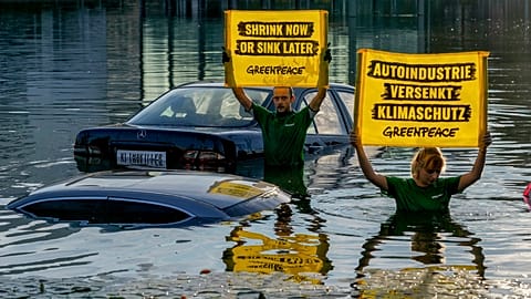 Activists of environmental organisation Greenpeace have drowned cars in a small lake at the first day of the IAA Mobility car showin Munich, Germany, Monday, Sept. 4, 2023. 