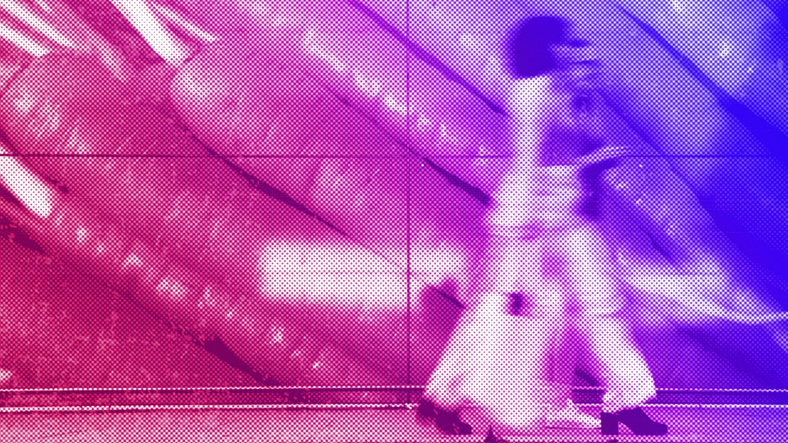 Shoppers walk past a large poster outside a supermarket in London, June 2023