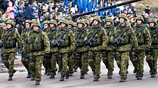 FILE Estonian troops parade in Narva, Estonia, Tuesday, Feb. 24, 2015. 