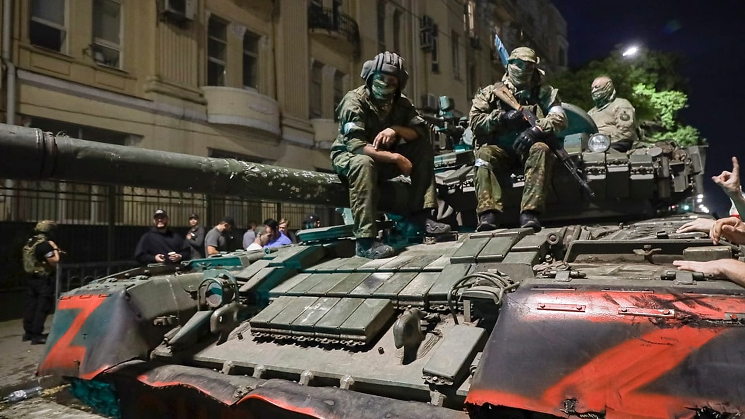 Members of the Wagner Group military company sit atop of a tank on a street in Rostov-on-Don, Russia, Saturday, June 24, 2023