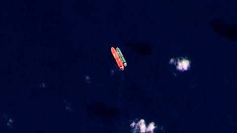 In this satellite photo provided by Planet Labs PBC, vessels identified as the Virgo, left, and the Suez Rajan, by the advocacy group United Against Nuclear Iran, are seen in 