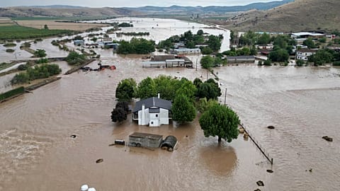 Floodwaters cover houses and farms after the country's record rainstorm in the village of Kastro, near Larissa, Thessaly region, central Greece, Thursday, Sept. 7, 2023
