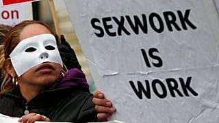 A French sex worker demonstrates outside the National Assembly in Paris, Friday, Nov. 29, 2013.